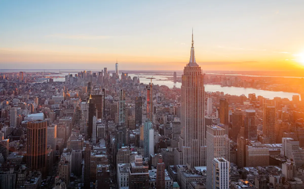 https://unsplash.com/photos/the-empire-state-building-shines-at-sunset-in-nyc-JUCIxMl7GMU