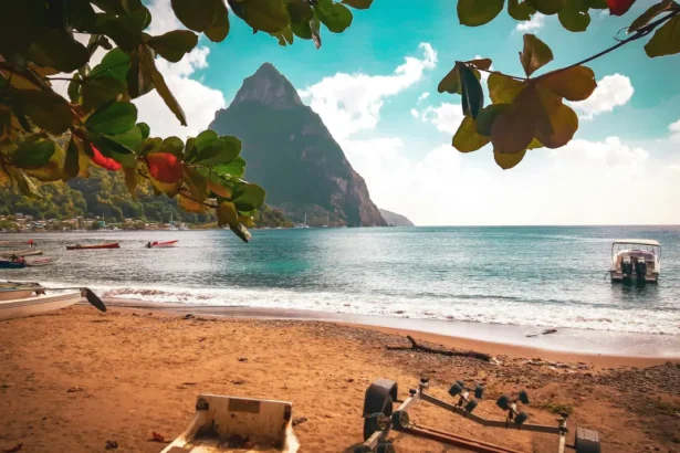 https://unsplash.com/photos/a-boat-sitting-on-top-of-a-beach-next-to-the-ocean-bJgZBhe6OrI