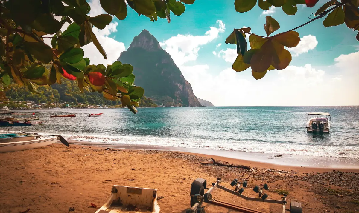 https://unsplash.com/photos/a-boat-sitting-on-top-of-a-beach-next-to-the-ocean-bJgZBhe6OrI